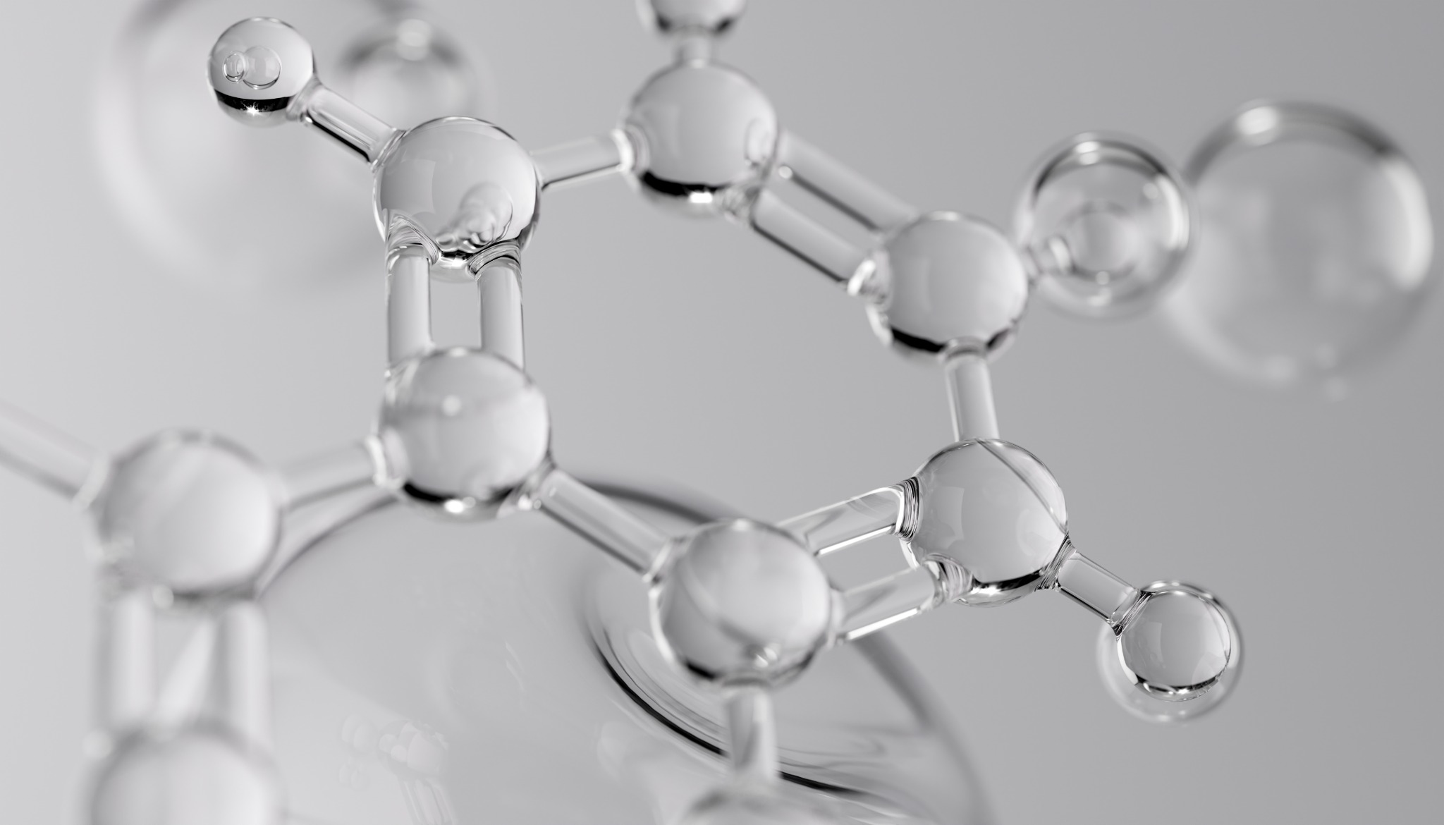 Glass-like molecular structure illustrating connected atoms and chemical bonds